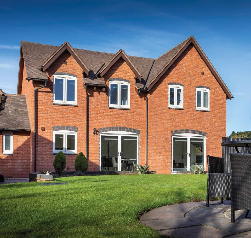 Brick detached home with white flush casement windows and French doors – Hale Windows And Doors