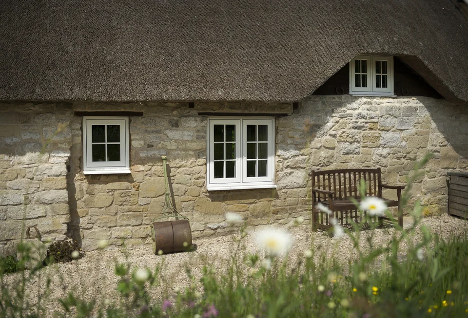 Thatched stone cottage with heritage casement windows – Hale Windows And Doors